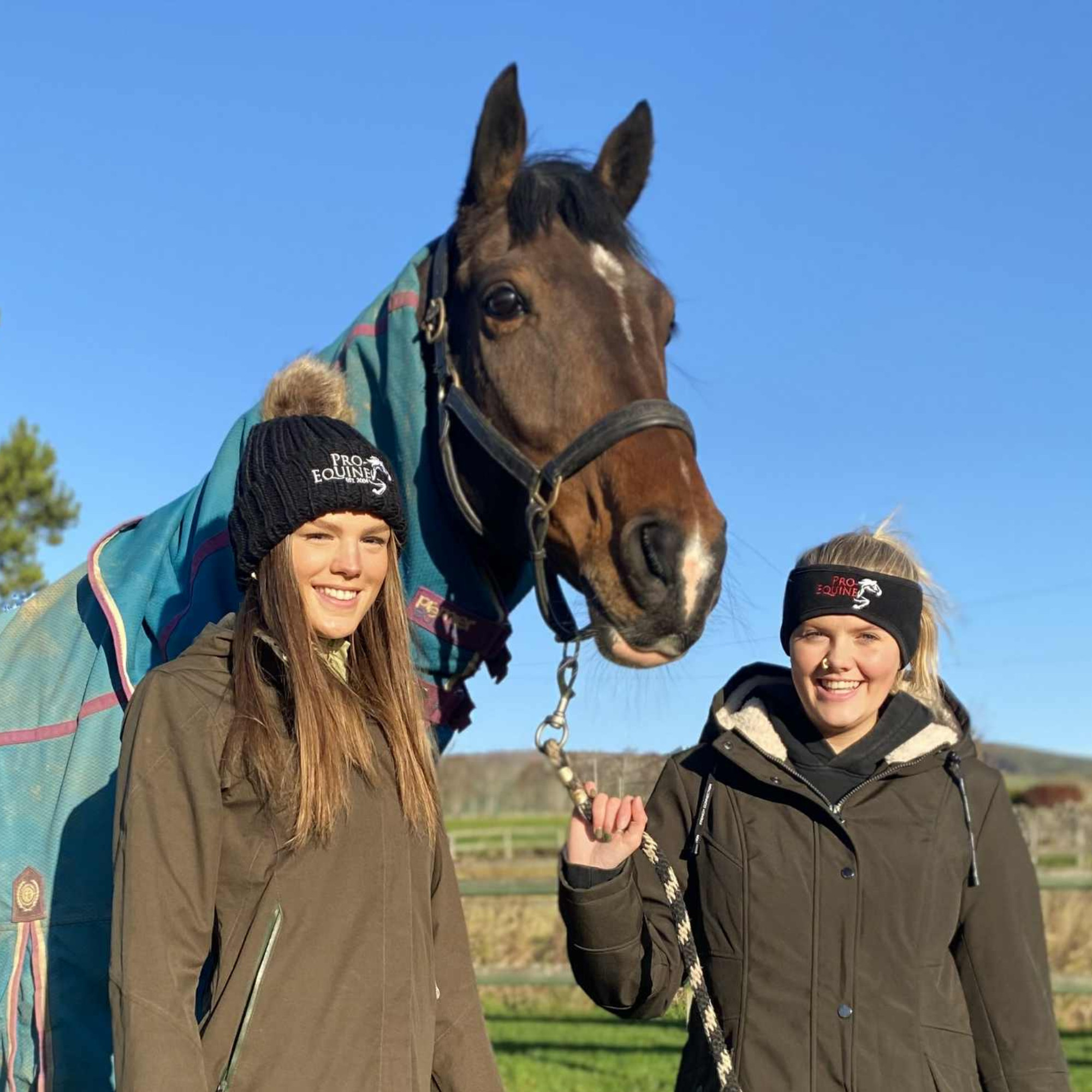 Image of horse with riders wearing Pro-Equine headwear